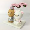 Picture of Rilakkuma wedding cake topper with Cherry Blossom Arch, Japanese Inspired Wedding Cake Decor, Sakura theme Cake Topper